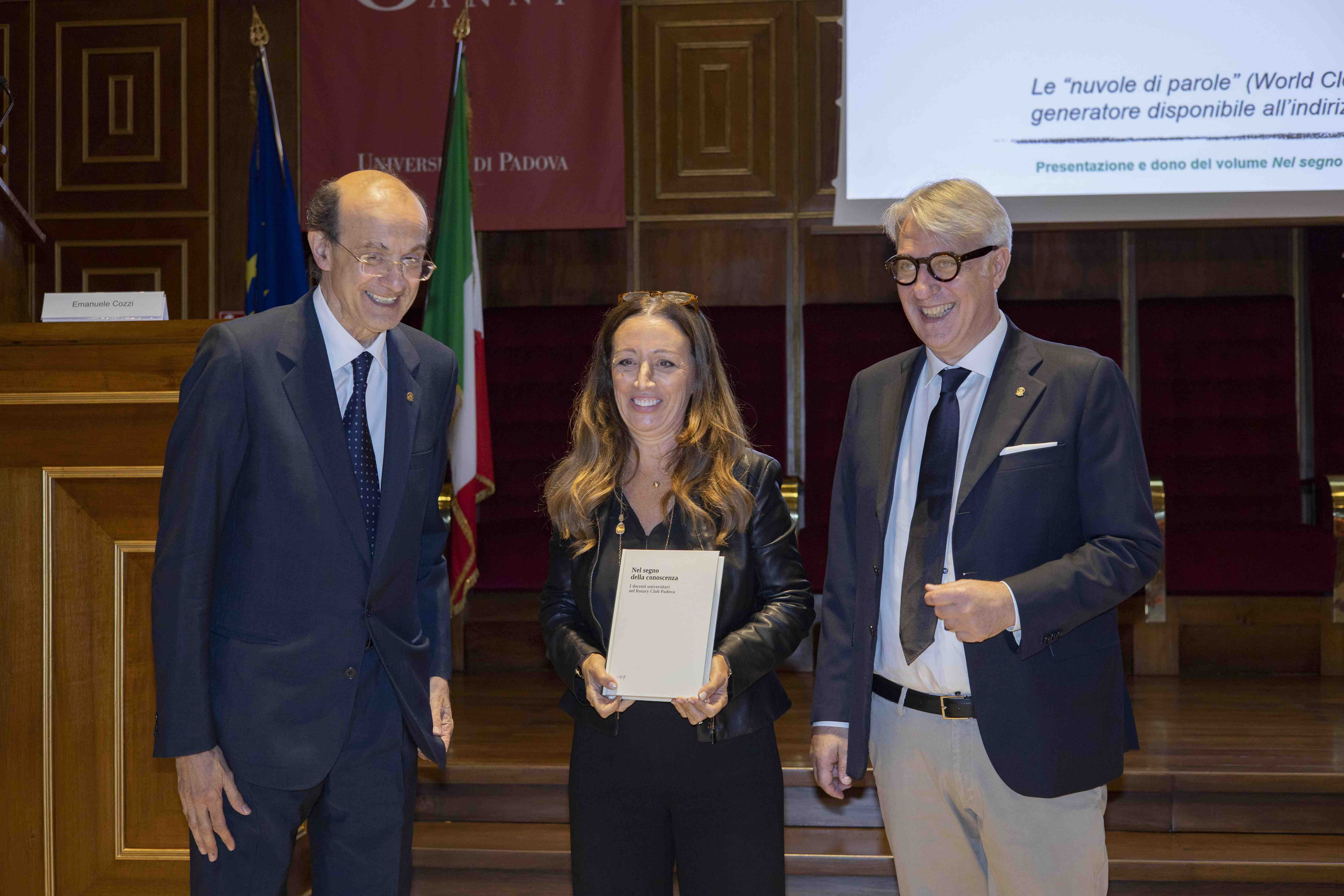 The Presidents of the Padua Rotary Club presents the book to the Rector